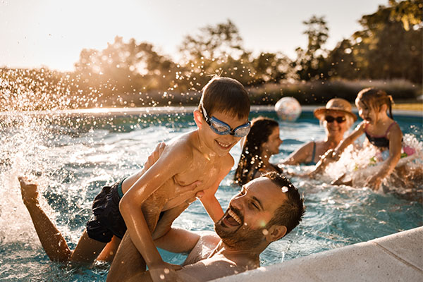 Family enjoying their swimming pool