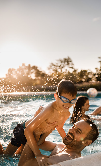 Father and Son playing in swimming pool